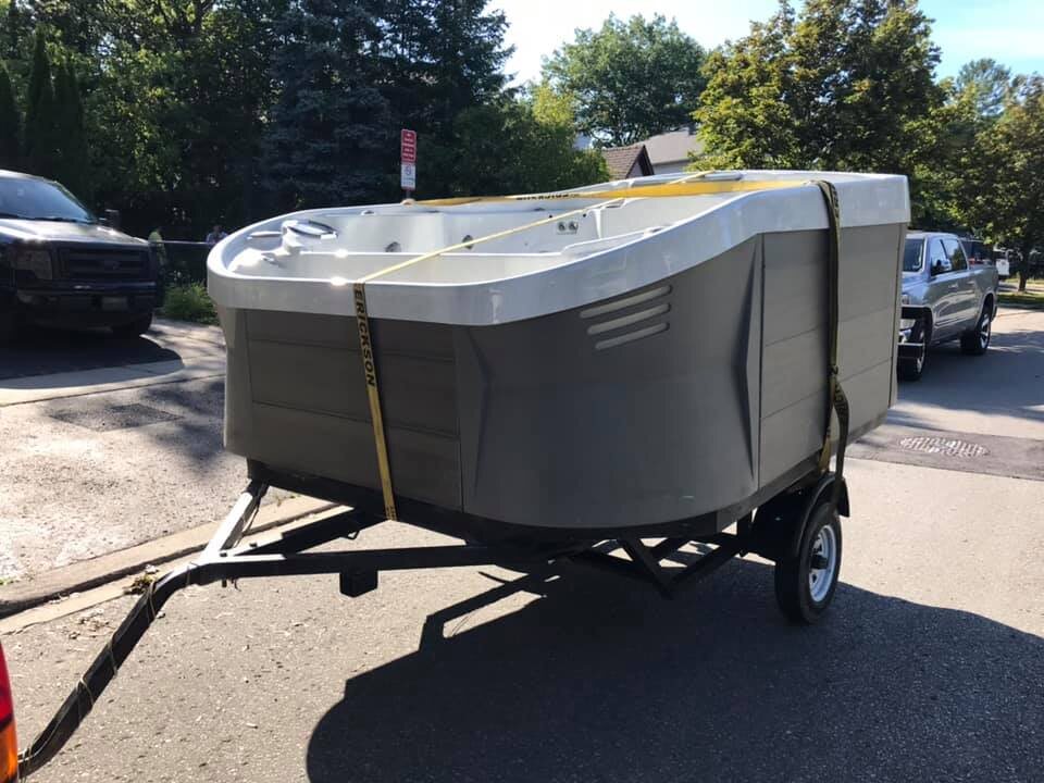 Hot tub loaded on a trailer for transport