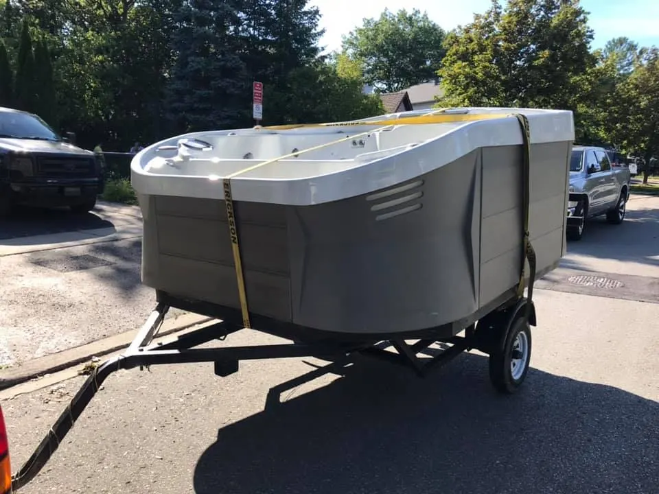 Hot tub loaded on a trailer for transport