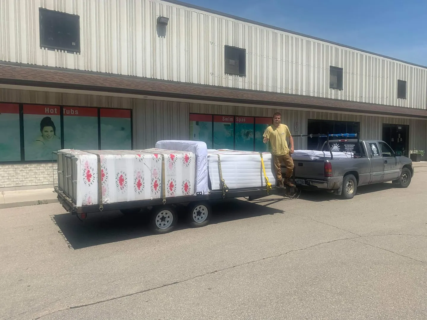 Wrapped hot tub picked up from a store on a trailer