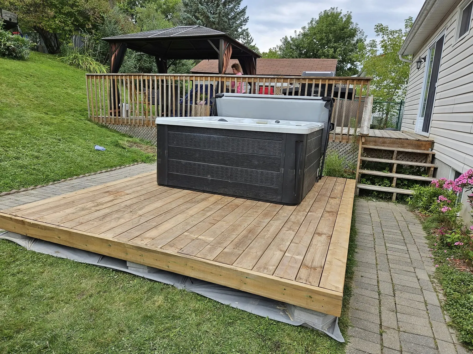 Hot tub placed on a backyard deck