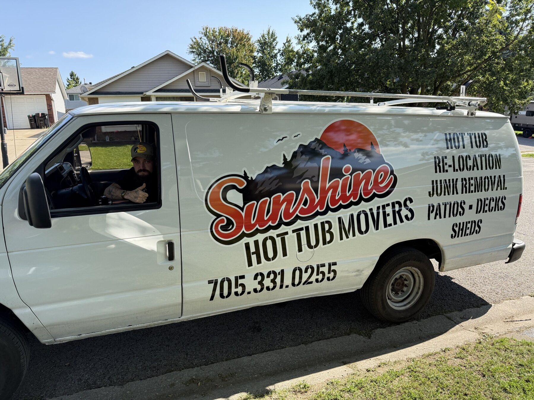 Sunshine Hot Tub Movers van with phone number